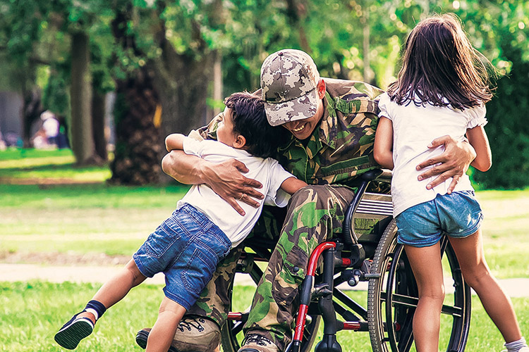 Happy,Disabled,Military,Man,In,Wheelchair,Returning,Home,And,Hugging